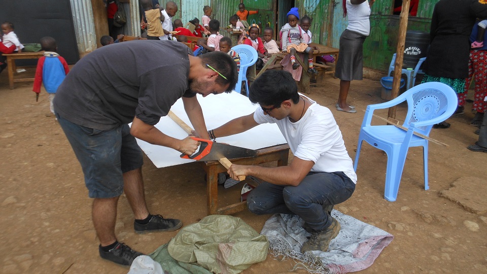 volunteers from the UK make new blackboards for the classrooms of Excel school in the slums of Nairobi home to some of the poorest people in the world